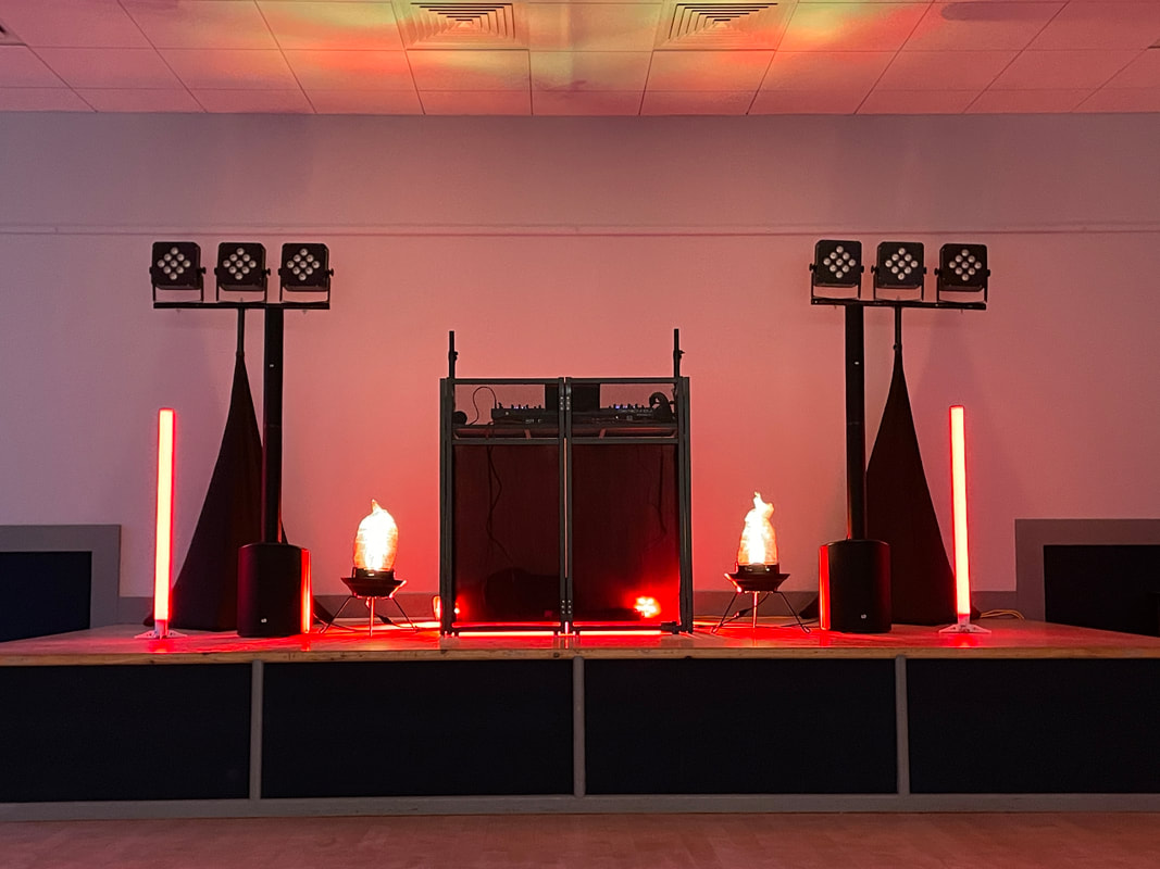 A picture of the speakers and lights set up for a wedding anniversary party